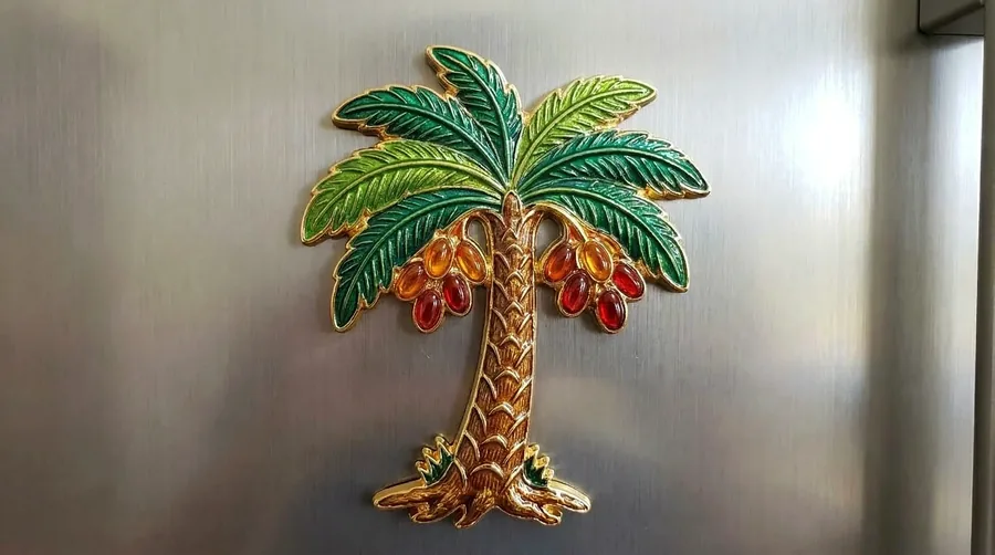 Date palm tree enamel magnet with translucent amber and red dates